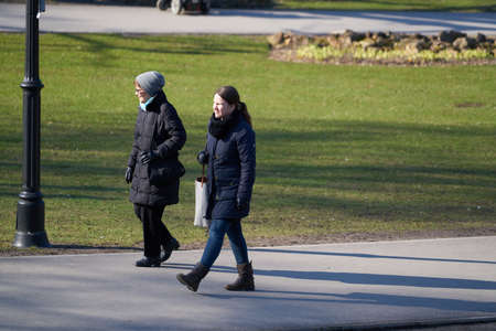 06-03-2020 Riga, Latvia People walking in city park.