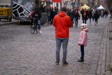 06-03-2020 Riga, Latvia Young father walking with tiny daughter.のeditorial素材