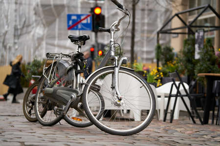 06-03-2020 Riga, Latvia The bike parked on the streets of European cities. Conceptual image of a...