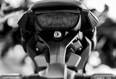 Close up of the rear of a brand new clasic motorcycle, soft focus, abstract background - Image