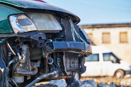 The headlight, hood and grille on the disassembled car.の写真素材