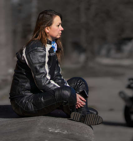 23-04-2020 Riga, Latvia Beautiful urban biker woman waiting for her ride.のeditorial素材