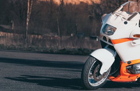 young man riding big bike motorcycle leaning curve on asphalt highways road.