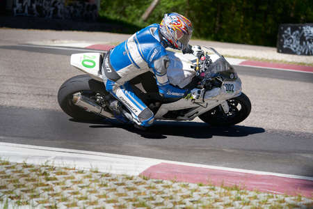 25-05-2020 Riga, Latvia. Motorcyclist goes on road, side view, closeup.