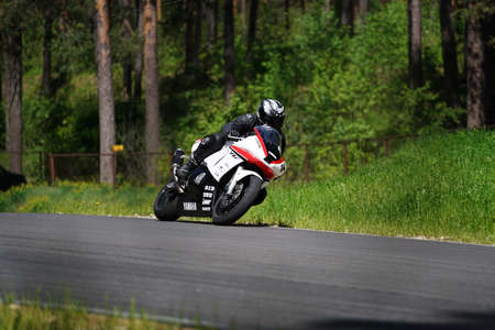 11-05-2020 Riga, Latvia Motorcyclist at sport bike rides by empty asphalt road. sport bike.のeditorial素材