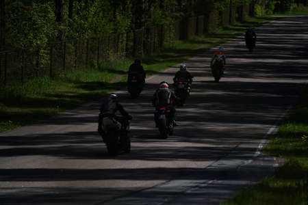 11-05-2020 Riga, Latvia Motorcyclist at sport bike rides by empty asphalt road. sport bike.のeditorial素材