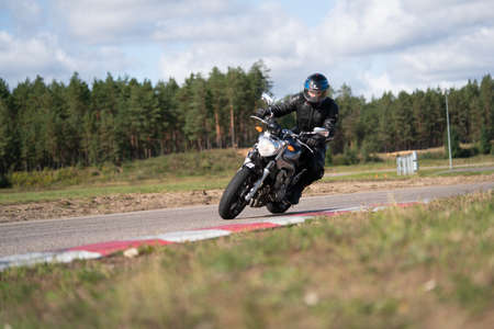 10-05-2020 Ropazi, Latvia Motorcycle practice leaning into a fast corner on track.