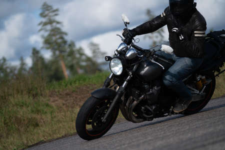 09/19/2020 Riga Latvia Handsome motorcyclist in black riding his super sport motorcycleのeditorial素材