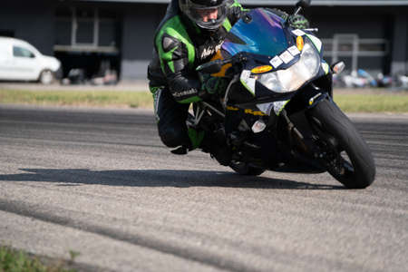 10-06-2020Riga Latvia Motorcycle practice leaning into a fast corner on track.