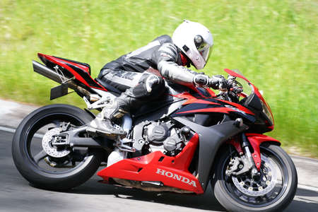 10-05-2020 Ropazi, Latvia Motorcyclist at sport bike rides by empty asphalt road. sport bike.
