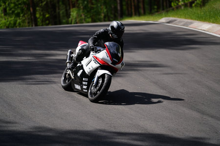 10-05-2020 Ropazi, Latvia Motorcyclist at sport bike rides by empty asphalt road. sport bike.