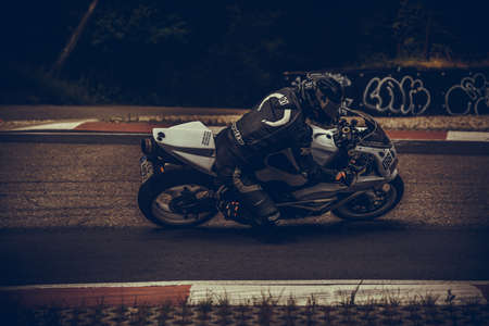 10-09-2020 Ropazi, Latvia Motorcyclist at sport bike rides by empty asphalt road. sport bike.