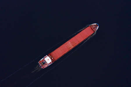 02-02-2021 Container ship on the Rhine River, Rhine Valley - UNESCO World Heritage Site, Germany.