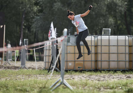 Running in city park. Woman runner outside jogging with Montreal skyline in backgroundのeditorial素材