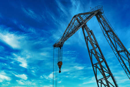 Port crane against grey skyの写真素材