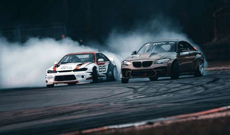 01-05-2021 Riga Latvia. car drifting with smoke, motion blur drift Unknown driver performs a drifting demonstrationのeditorial素材