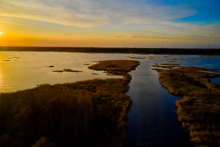 Nice landscape with sunset on lakeの写真素材