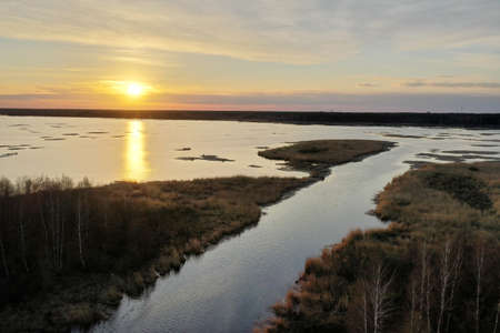 sunset at coast of the lakeの写真素材