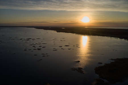 Nice landscape with sunset on lakeの写真素材