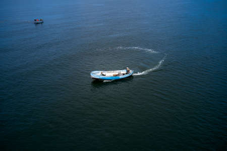 Fishing boats floating on the sea.のeditorial素材