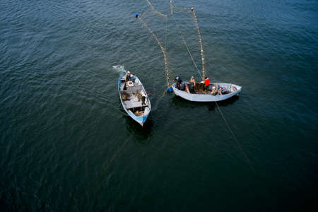 Fishing boats floating on the sea.のeditorial素材