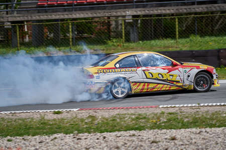 22-1-05-2021 Riga, Latvia. Power drifting car from side.のeditorial素材