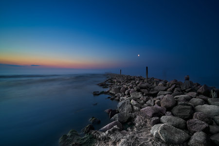 Coastal landscape with old broken pier, Baltic Sea, Latvia. long exposure. fog. twilight.の写真素材