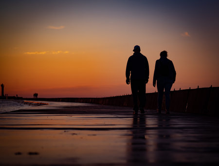 Man and woman love silhouette in sunset.の写真素材