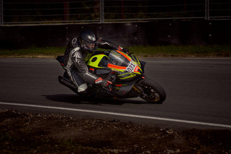 10-05-2020 Riga Latvia Motorcycle practice leaning into a fast corner on track.