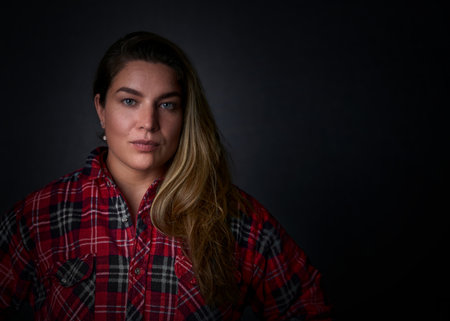 Beautiful woman face close up portrait young studio on grayの写真素材