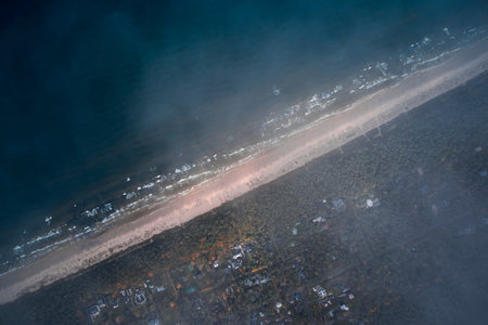 Aerial drone view of garbage dump on the beach at night. Pollution environment conceptの写真素材