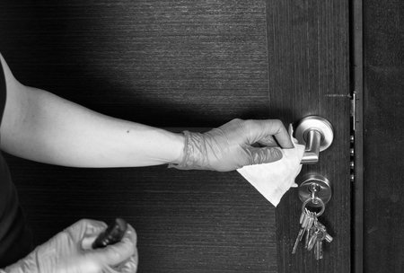 Disinfection, cleaning and washing of door handles. Coronavirus infection preventionの写真素材