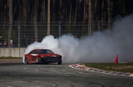 11-05-2022 Riga, Latvia Unknown rider on the car brand BMW driving drift car with smoke