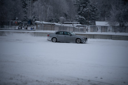 12-12-2022 Riga, Latvia a car is parked in a parking lot in the snow. .のeditorial素材