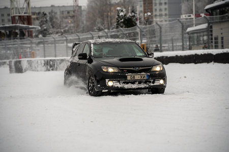 12-12-2022 Riga, Latvia a car driving through a snow covered parking lot in the wintertime with a lot of snow on the ground. .のeditorial素材