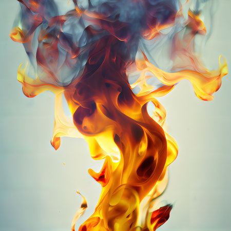 a fire is shown with a blue sky in the background and a yellow and red fire in the foreground. .の写真素材