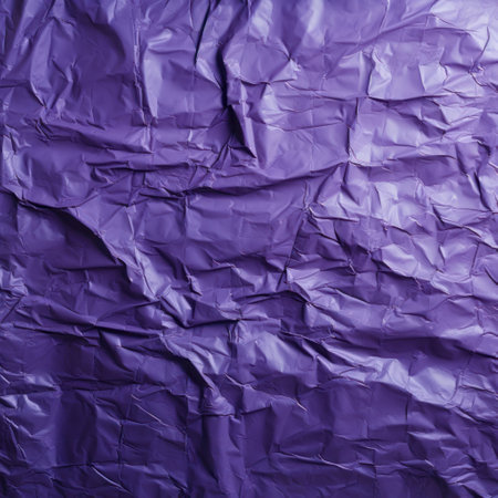 Texture of crumpled purple paper as background, close-upの素材