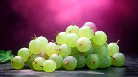 Green grapes on wooden table with purple background. Selective focus.の素材