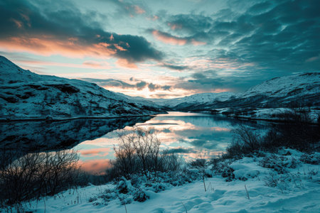 Beautiful winter landscape with snow covered mountains and lake in Iceland. Toned.の素材