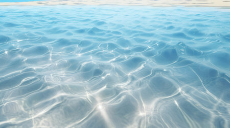 Blue water surface in swimming pool background. Water surface with sun reflection.の素材