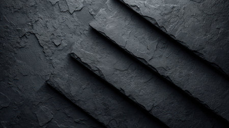 Black stone background. Texture of black slate. Dark slate background.の素材