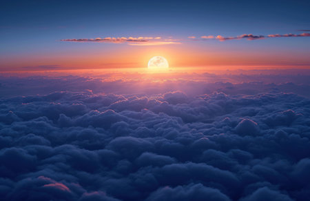 Beautiful sunset above clouds. Panoramic view from airplane window.の素材