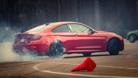 Latvia, Riga 03-05.10.2025. FIA Drifting cup. A red car with a red cone in front of it. .