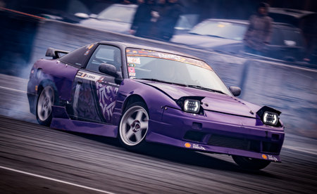 Latvia, Riga 03-05.10.2025. FIA Drifting cup. A purple car with a lot of smoke coming out of it. .