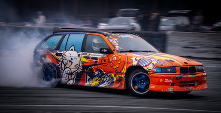 Latvia, Riga 03-05.10.2025. FIA Drifting cup. A car with a cat painted on the side of it is drifting...