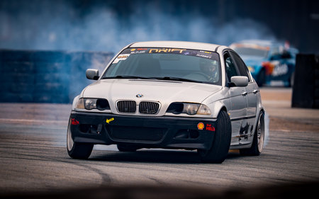 Latvia, Riga 03-05.10.2025. FIA Drifting cup. A white car with a lot of smoke coming out of it. .