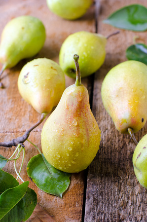 Fresh pears on a wooden tableの写真素材