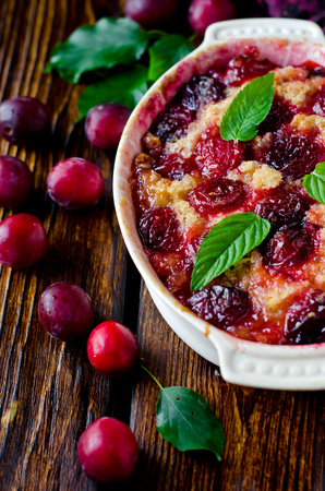 Cake with plums and caramelの写真素材