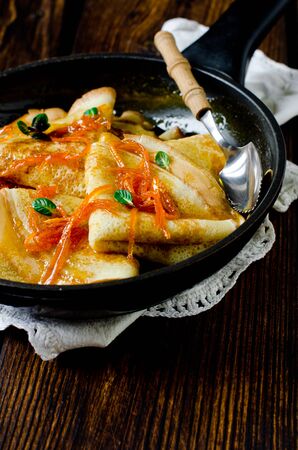 Crepe suzette, traditional french pancakes with orange syrupの写真素材