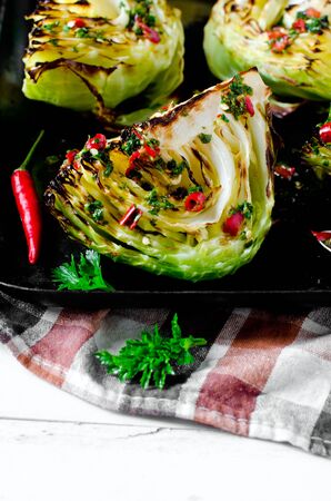 Baked young cabbage with spicy sauceの写真素材